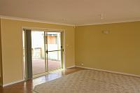  looking from the loungeroom near the kitchen to the door out to the back patio